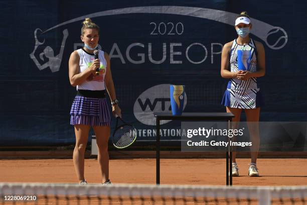 Simona Halep of Romania celebrates after winning the Women's Singles Final, alongside runner-up Elise Mertens of Belgium, during the WTA Prague Open...