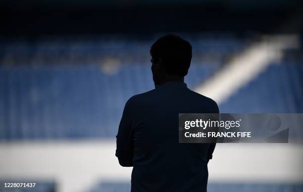 Lyon's French head coach Rudi Garcia attends a training session at the Restelo stadium in Lisbon on August 16 a day after defeating Manchester City...