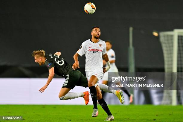 Sevilla's Moroccan forward Youssef En-Nesyri and Manchester United's English defender Brandon Williams vie for the ball during the UEFA Europa League...
