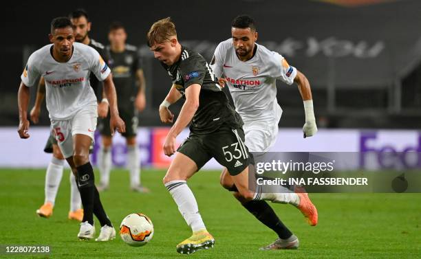 Manchester United's English defender Brandon Williams runs with the ball during the UEFA Europa League semi-final football match Sevilla v Manchester...
