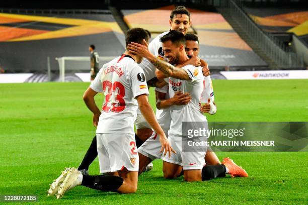 Sevilla's Spanish midfielder Suso celebrates scoring with his team-mates during the UEFA Europa League semi-final football match Sevilla v Manchester...