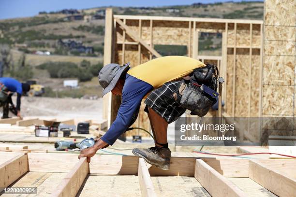 Contractor frames a home under construction in Park City, Utah, U.S., on Friday, Aug. 14, 2020. U.S. Home construction starts rose 17% in June, with...