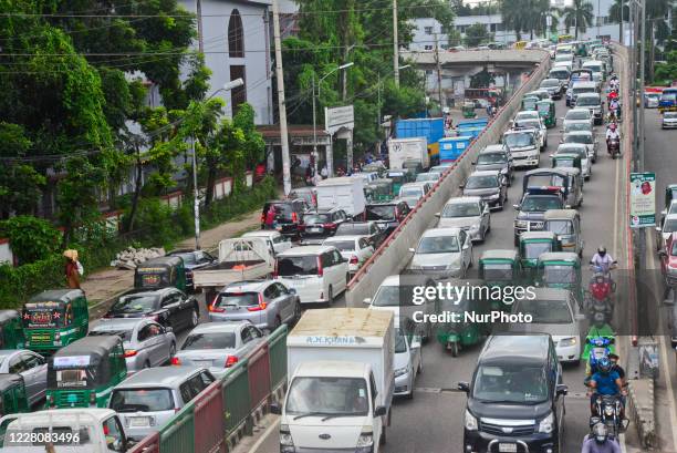 Commuters make their way through a traffic jam during the coronavirus outbreak in Dhaka, Bangladesh, on August 17, 2020.