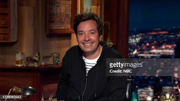 Episode 1306A -- Pictured in this screengrab: Host Jimmy Fallon arrives at his desk on August 12, 2020 --