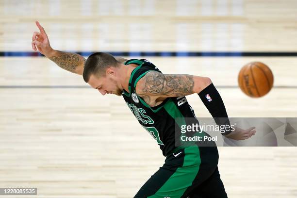 Daniel Theis of the Boston Celtics celebrates after a dunk against the Philadelphia 76ers during the first half at The Field House at ESPN Wide World...