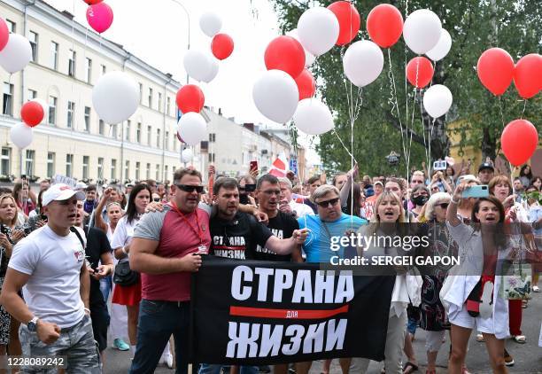 Opposition supporters gather outside a pre-trial detention centre, where Sergei Tikhanovsky - opposition figure Svetlana Tikhanovskaya's jailed...