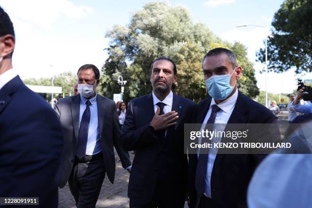 Former Lebanese prime minister Saad Hariri, reacts as he leaves the UN-backed Special Tribunal for Lebanon at Leidschendam on August 18 after the...