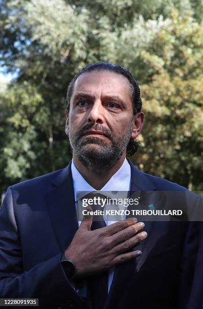 Former Lebanese prime minister Saad Hariri reacts as he leaves the UN-backed Special Tribunal for Lebanon at Leidschendam on August 18 after the...