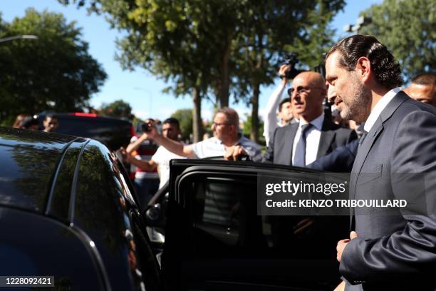 Former Lebanese prime minister Saad Hariri reacts as he leaves the UN-backed Special Tribunal for Lebanon at Leidschendam on August 18 after the...