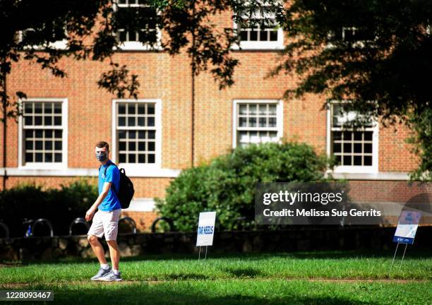 Student walks through the campus of the University of North Carolina at Chapel Hill on August 18, 2020 in Chapel Hill, North Carolina. The school...