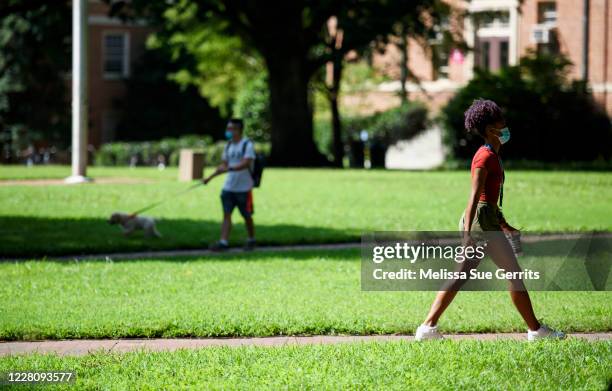 Students walk through the campus of the University of North Carolina at Chapel Hill on August 18, 2020 in Chapel Hill, North Carolina. The school...