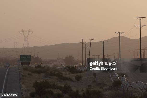 Transmission towers and power lines near Winterhaven, California, U.S., on Tuesday, Aug. 18, 2020. California is bracing for another round of rolling...