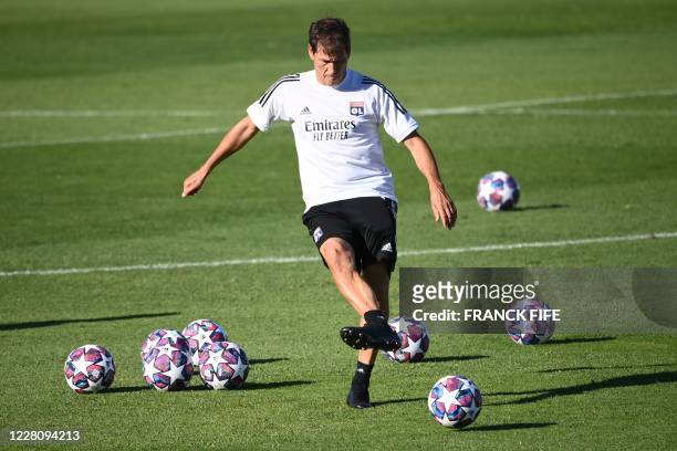 Lyon's French coach Rudi Garcia kicks a ball during a training session at the Restelo training ground in Lisbon on August 18, 2020 on the eve of the...
