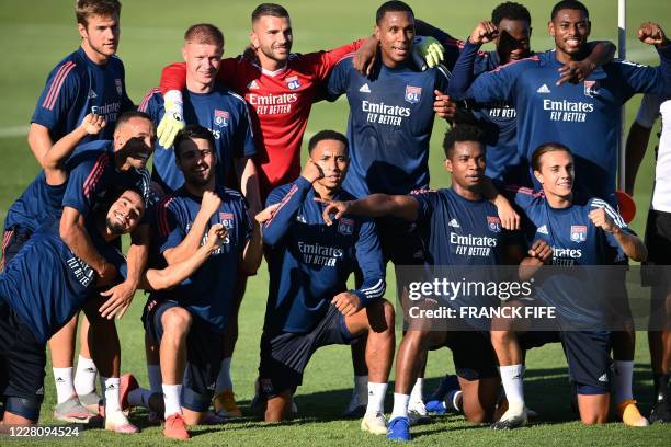 Lyon's players pose during a training session at the Restelo training ground in Lisbon on August 18, 2020 on the eve of the UEFA Champions League...