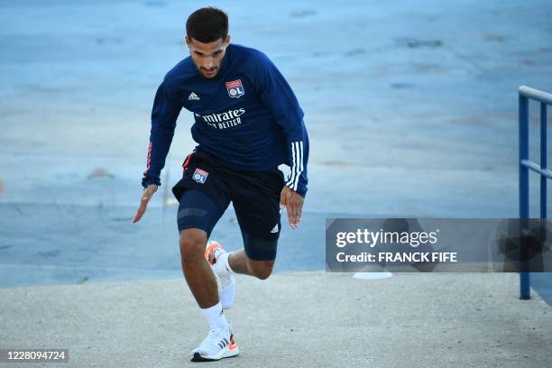 Lyon's French midfielder Houssem Aouar attends a training session at the Restelo training ground in Lisbon on August 18, 2020 on the eve of the UEFA...