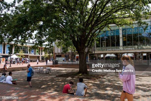 Students walk through the campus of the University of North Carolina at Chapel Hill on August 18, 2020 in Chapel Hill, North Carolina. The school...
