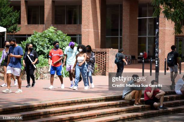Students walk through the campus of the University of North Carolina at Chapel Hill on August 18, 2020 in Chapel Hill, North Carolina.The school...