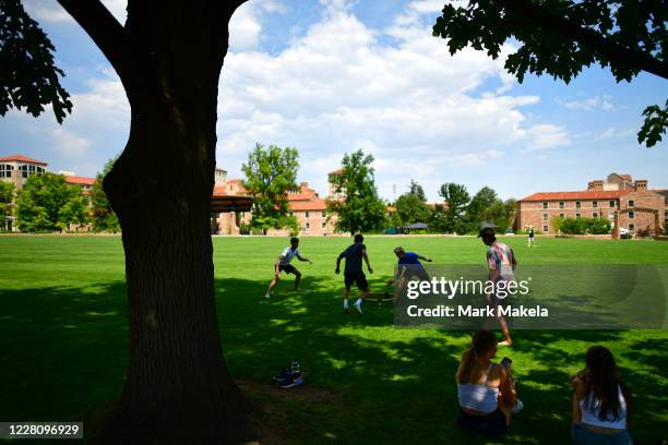 Group of incoming freshmen play spike ball on campus after moving into dormitories at University of Colorado Boulder on August 18, 2020 in Boulder,...