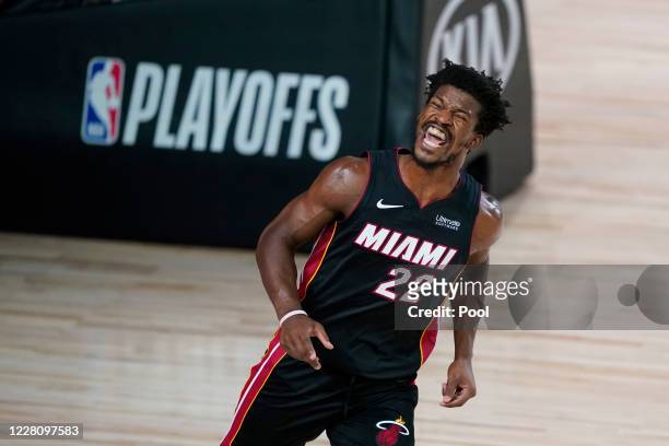 Jimmy Butler of the Miami Heat reacts after dunking against the Indiana Pacers during the second half at AdventHealth Arena at ESPN Wide World Of...