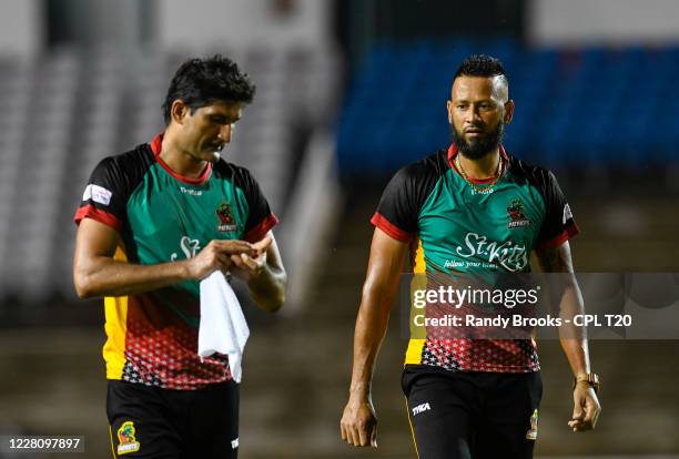 Sohail Tanvir and Rayad Emrit of St Kitts & Nevis Patriots during the Hero Caribbean Premier League match 2 between Barbados Tridents and St Kitts &...