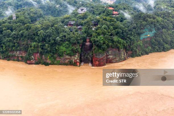 This aerial photo taken on August 18, 2020 shows the Leshan Giant Buddha surrounded by floodwaters following heavy rains in Leshan in China's...