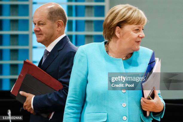 German Chancellor Angela Merkel and German Minister of Finance Olaf Scholz attend a cabinet meeting at the German chancellery on August 19, 2020 in...