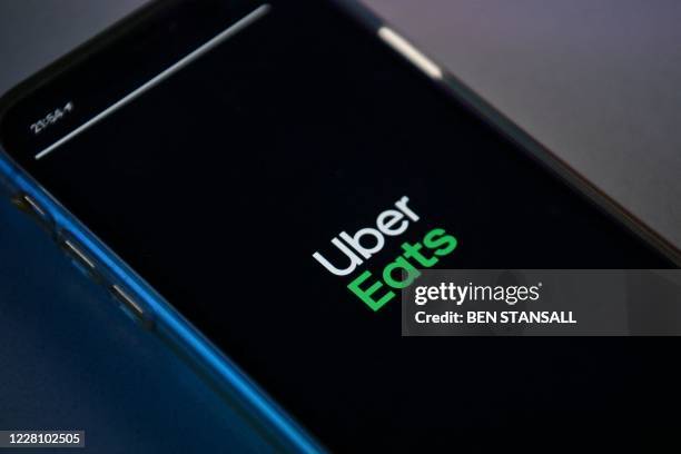 Photograph arranged as an illustration in Brenchley, south-east England on August 18, 2020 shows the Uber Eats app on a smart phone.