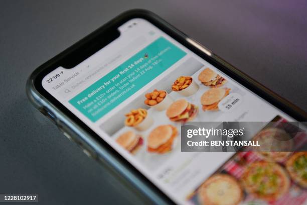 Photograph arranged as an illustration in Brenchley, south-east England on August 18, 2020 shows the food delivery Deliveroo app on a smart phone.