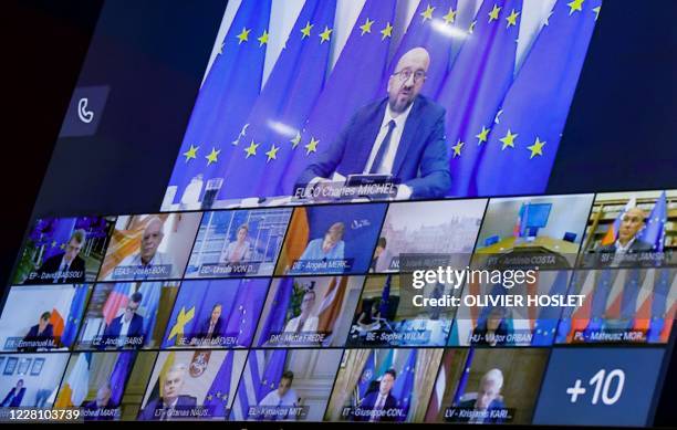 Photograph taken on August 19, 2020 at the EU headquarters in Brussels shows a screen displaying European Council President Charles Michel, European...