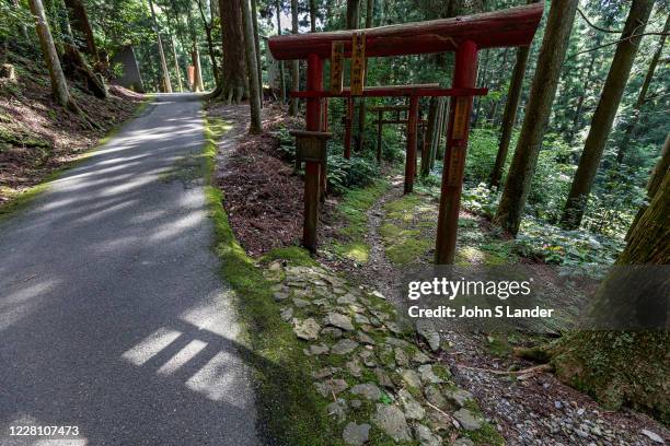 Torii and Henro Trail at Yokomineji - temple number 60 on the Shikoku pilgrimage. Yokomine-ji was originally an affiliated temple of the holy...