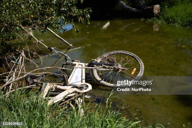Bicycle lies in the Garonne river. The Garonne river is near its record low levels due to a lack of rain since the beginning of 2020 and a scorching...