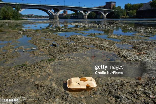 Wrapping lies on the Garonne' riverbed. The Garonne river is near its record low levels due to a lack of rain since the beginning of 2020 and a...