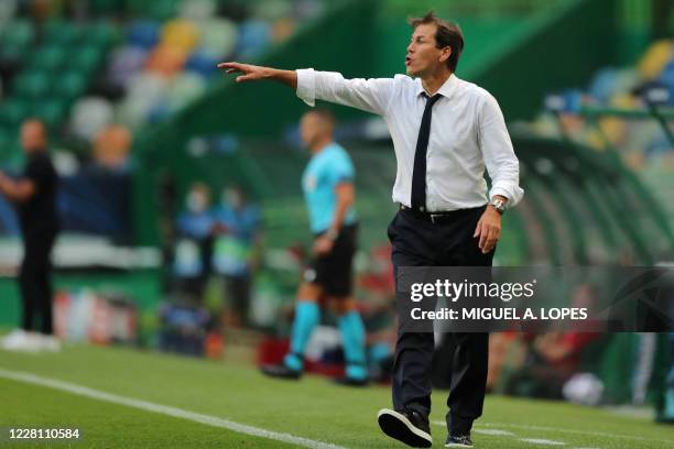 Lyon's French coach Rudi Garcia reacts during the UEFA Champions League semi-final football match between Lyon and Bayern Munich at the Jose Alvalade...