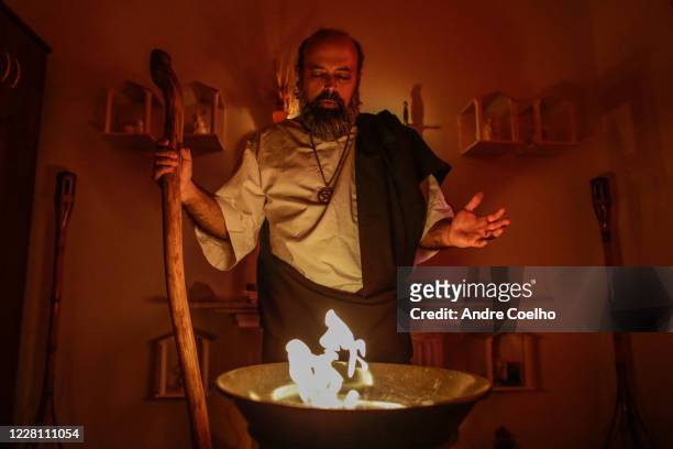 The high priest Wicca Og Sperle, prays alone during the ritual named Lughnasadh, also known as Lammas or Thalysia Festival, at the Temenos Aetòs...