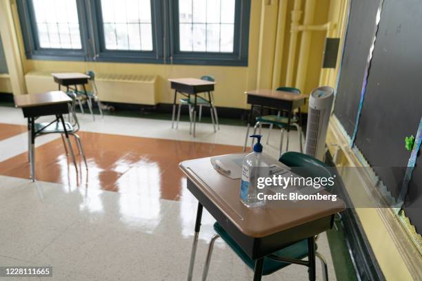 Hand sanitizer sits on a student's desk during a news conference at New Bridges Elementary School in the Brooklyn borough of New York, U.S., on...