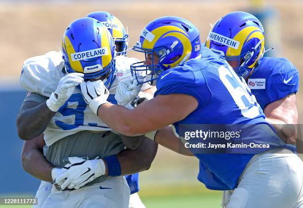 Defensive tackle Marquise Copeland and defensive end Austin Blythe grab each others face masks which resulted in a minor scuffle during training camp...