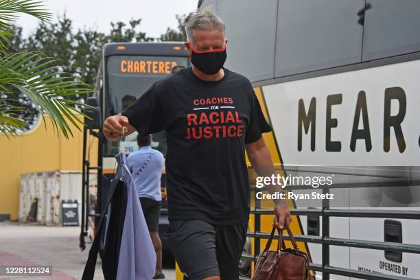 Brett Brown of the Philadelphia 76ers arrives to the arena before Round One Game Two of the 2020 NBA Playoffs against the Boston Celtics on August...