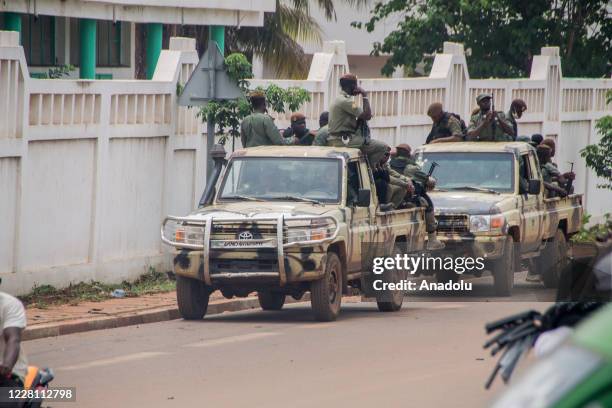 Soldiers patrol near as military arrested Malian president Ibrahim Boubacar Keita is being held in the Kati garrison, which is 15 kilometers from the...