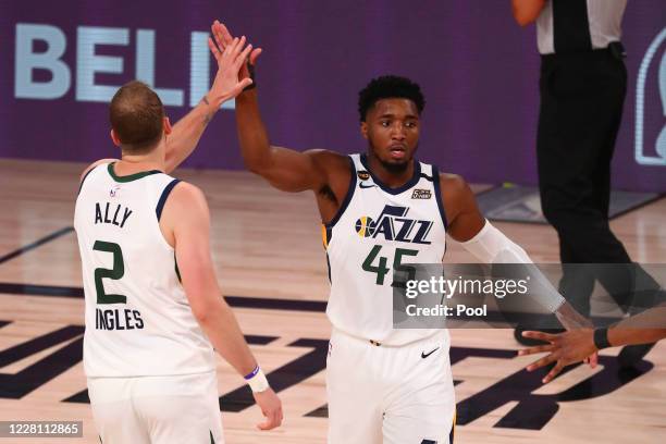 Utah Jazz guard Joe Ingles of the Utah Jazz and Donovan Mitchell celebrate against the Denver Nuggets during game two in the first round of the 2020...