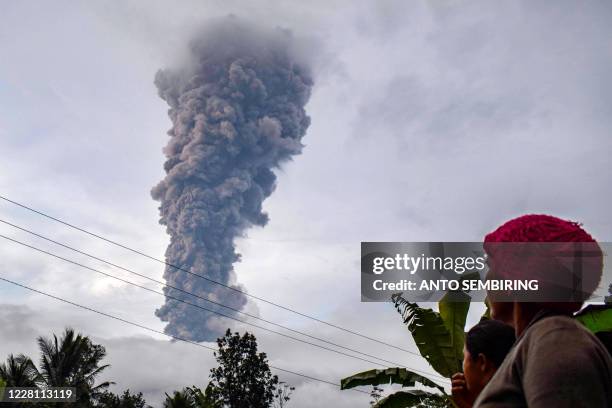 This photo taken on August 19, 2020 shows Mount Sinabung spewing ash into the air in Karo, North Sumatra. - Indonesia is home to about 130 active...