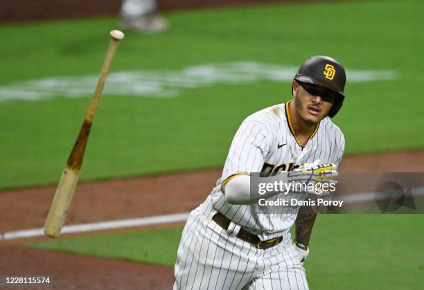 Manny Machado of the San Diego Padres hits a walk-off grand slam during the 10th inning of a baseball game against the Texas Rangers at Petco Park on...