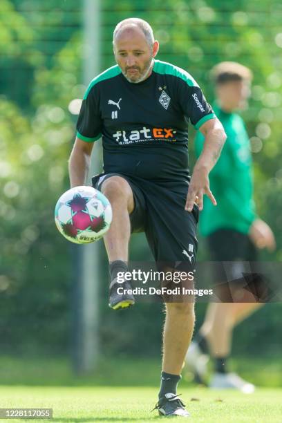 Assistant coach Oliver Neuville of Borussia Moenchengladbach controls the ball during day 3 of the pre-season summer training camp of Borussia...