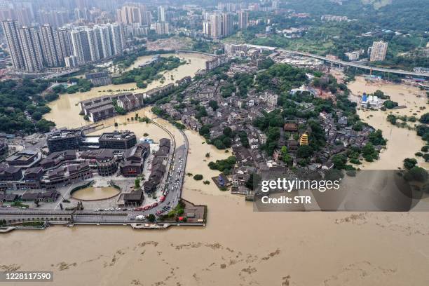 This aerial photo taken on August 19, 2020 shows a flooded area in China's southwestern Chongqing. - Floods in mountainous southwest China have...