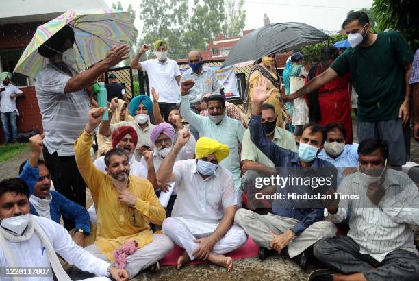 Leader and Member of Parliament from Sangrur Bhagwant Mann sits in protest with Punjabi University Teachers Association in front of Vice Chancellor...