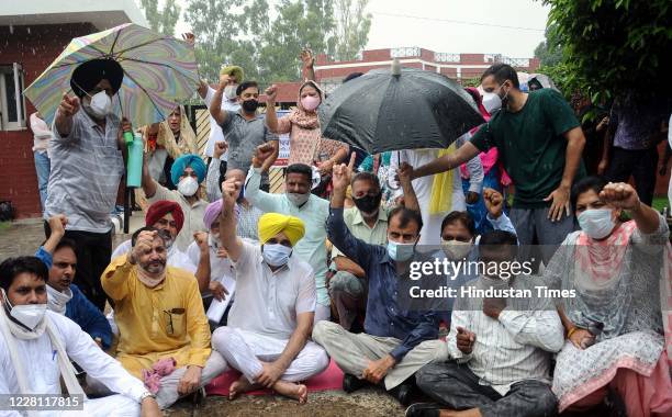 Leader and Member of Parliament from Sangrur Bhagwant Mann sits in protest with Punjabi University Teachers Association in front of Vice Chancellor...