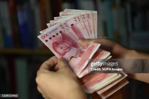 New 100 Rmb 100 Yuan Banknotes Photos and Premium High Res Pictures - Getty Images