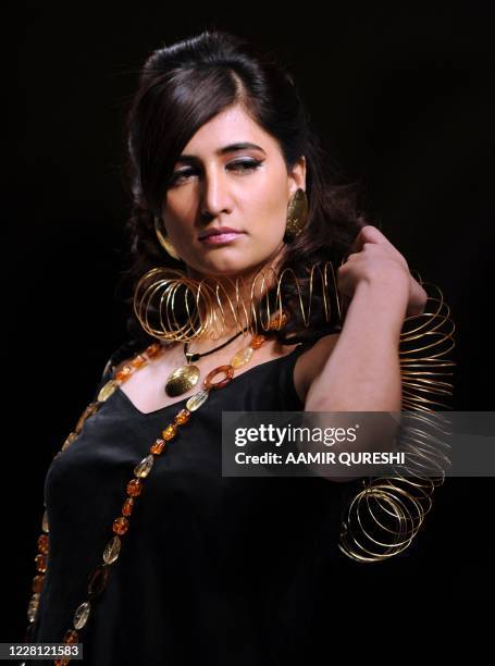 Pakistani model presents creation by Pakistani designer Shafaq Habib during first day of Islamabad Fashion Week in Islamabad on January 27, 2011....