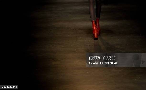 Model presents a creation by fashion designer Charles Anastase for the Autumn/Winter 2011 collection, on the second day of the London Fashion Week in...
