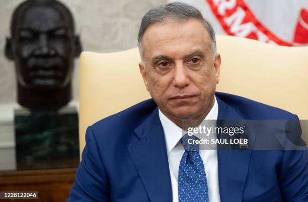 Iraqi Prime Minister Mustafa al-Kadhemi attends a meeting with US President Donald Trump in the Oval Office of the White House in Washington, DC,...