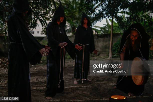 First degree Wicca priestesses listen while Jussara Gabriel a Wiccan High priestess uses a ritual drum during the Imbolc, the seasonal sabbat in...